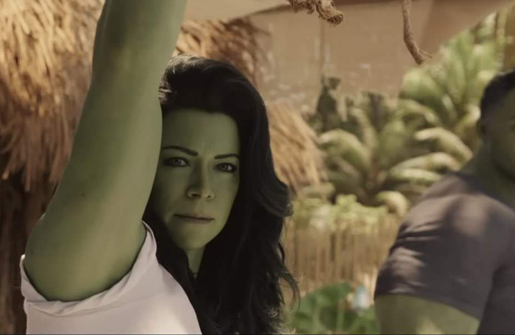She-Hulk (Tatiana Maslany) looks at the viewer as the Hulk teaches her to control her powers in a still from the Disney+ show 