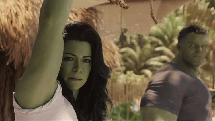She-Hulk (Tatiana Maslany) looks at the viewer as the Hulk teaches her to control her powers in a still from the Disney+ show "She-Hulk."