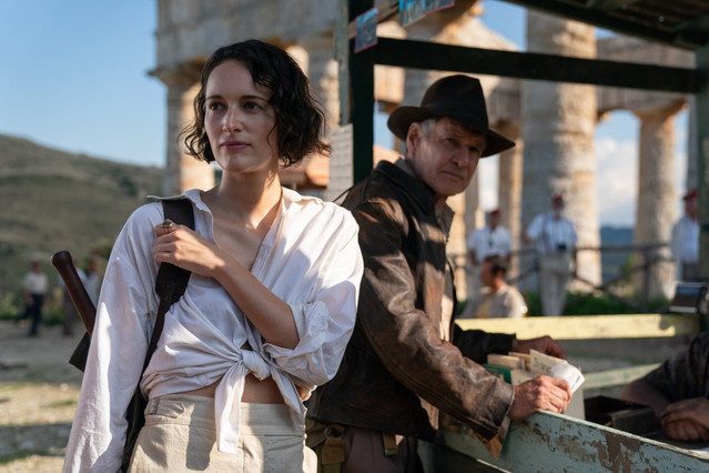 Phoebe Waller-Bridge and Harrison Ford by a jeep in front of ruins in Indiana Jones 5