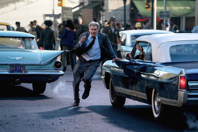 Harrison Ford running between cars in Indiana Jones 5