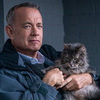 Tom Hanks holding a cat in A Man Called Otto