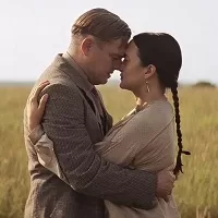 Leonardo DiCaprio and Lily Gladstone embracing in Killers of the Flower Moon